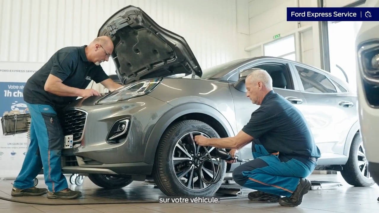 Men repairing car